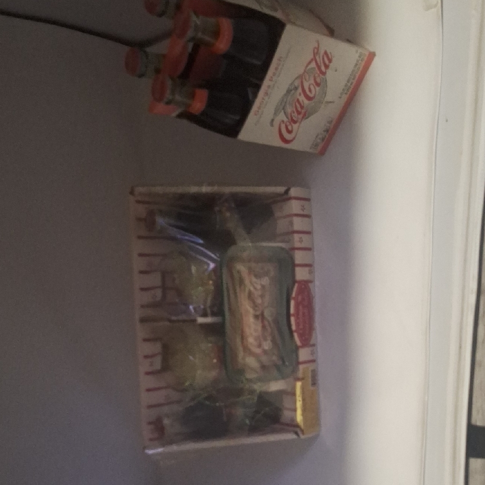 Coca Cola Bottles with Red and White Packaging